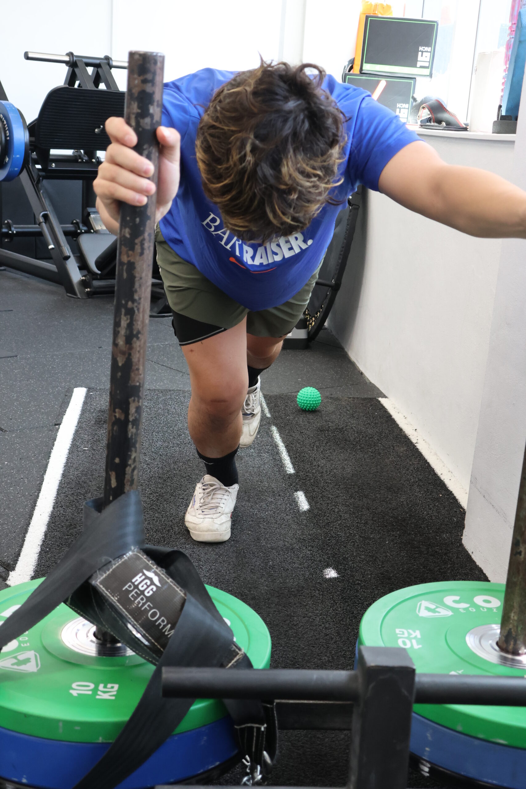 Young NDIS participant working on strength and capacity building exercises